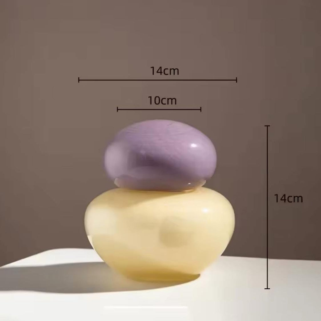 colored glass vases with rounded stoppers