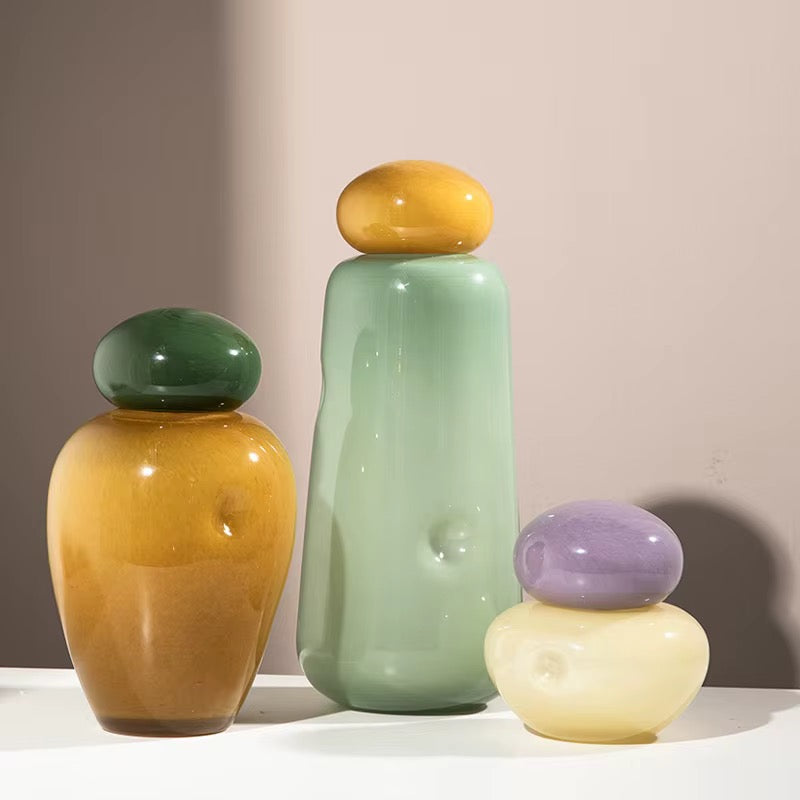 colored glass vases with rounded stoppers
