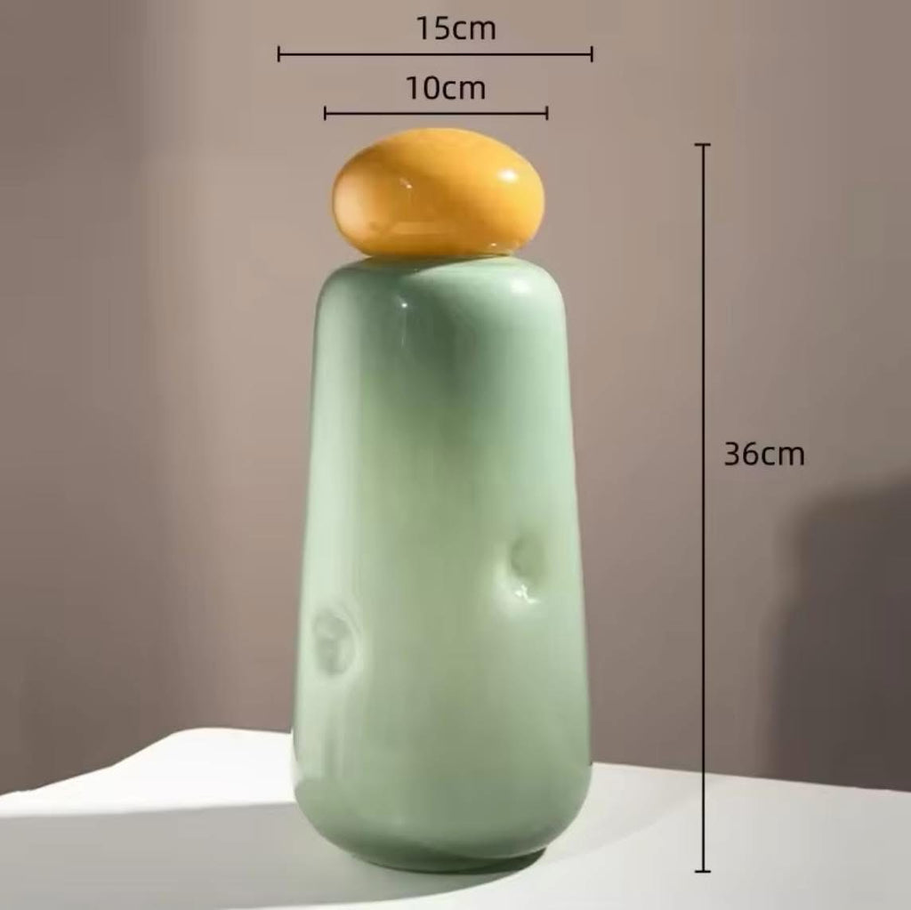 colored glass vases with rounded stoppers